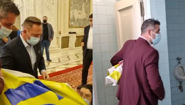 VIDEO Dictatura USL a început prin furtul unui banner afișat de protestatari în Parlament. Hoțul s-a ascuns în WC, fiind urmărit de deputatul Mihai Polițeanu